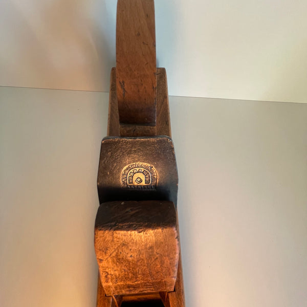 Vintage table lamp, old wood plane with edison bulb, crafted by shades at grays, nz. Close up of cutting blade and original branding.