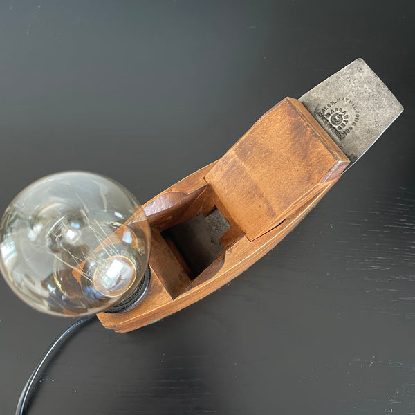 Authentic wood plane table lamp crafted by shades at grays, top view.