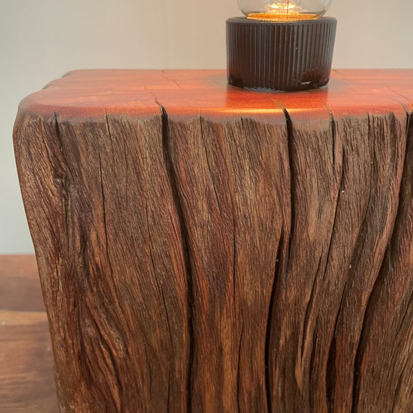 Wood table lamp made from upcycled wharf timber and replica edison bulb, close up of front view and erosion grooves, handcrafted by shades at grays.