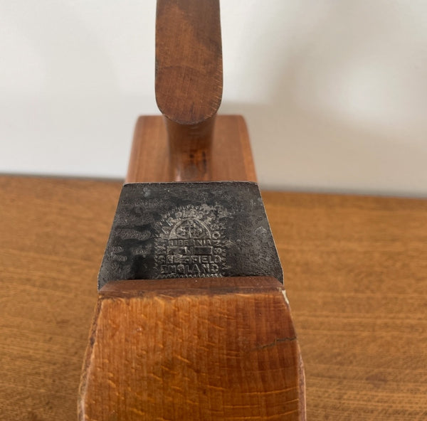 Wood table lamp upcycled by shades at grays from authentic carpenters plane close up of branded cutting blade.