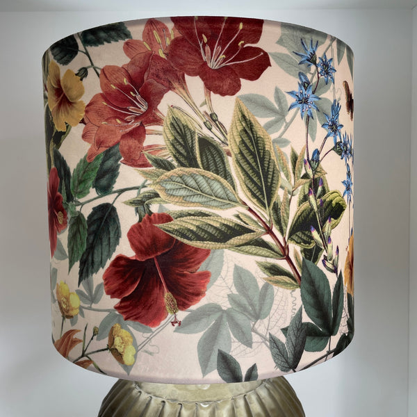 35 cm handmade drum lampshade by shades at grays using velvet bouquet fabric, left side view, lit.