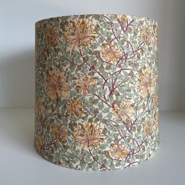 Tapered lampshade in William Morris honeysuckle fabric, unlit.