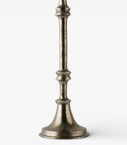 Close-up of the oxidised silver finish and sculpted details on the aluminium candlestick lamp base