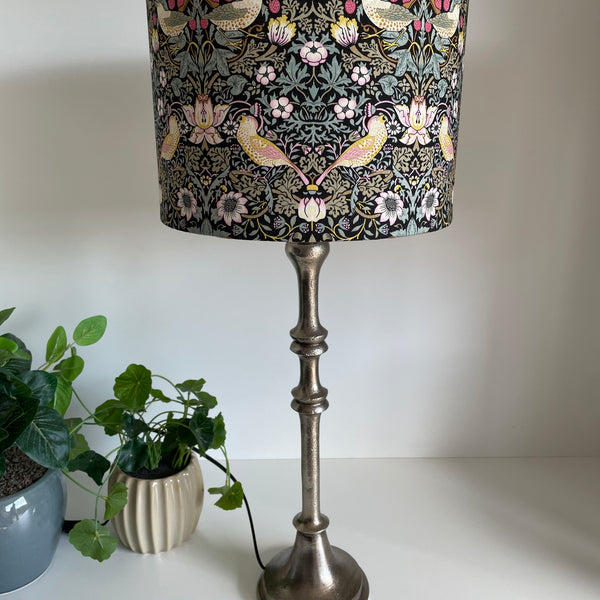 Antique silver candlestick lamp base styled with a William Morris Strawberry Thief lampshade, sold separately