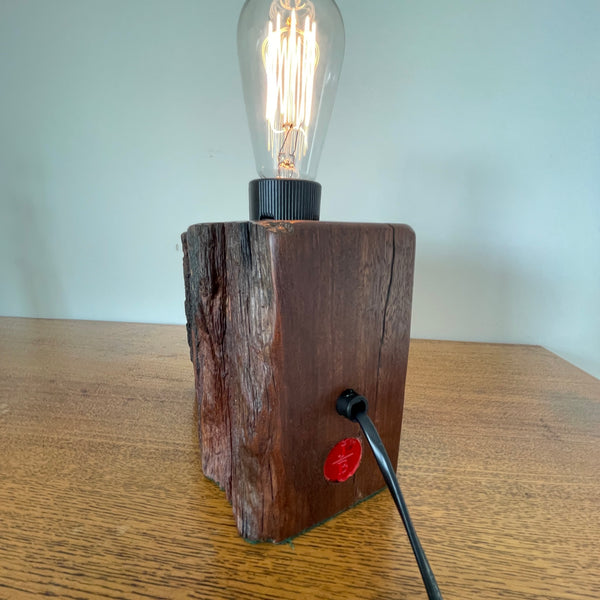 Reclaimed century old wharf timber table lamp created by Shades at Grays, back and side view, with red makers branding mark and black lead.