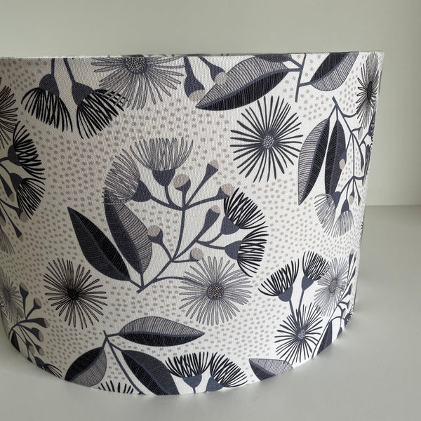 Barrel style lampshade by shades at grays with eucalyptus blossom fabric, unlit.