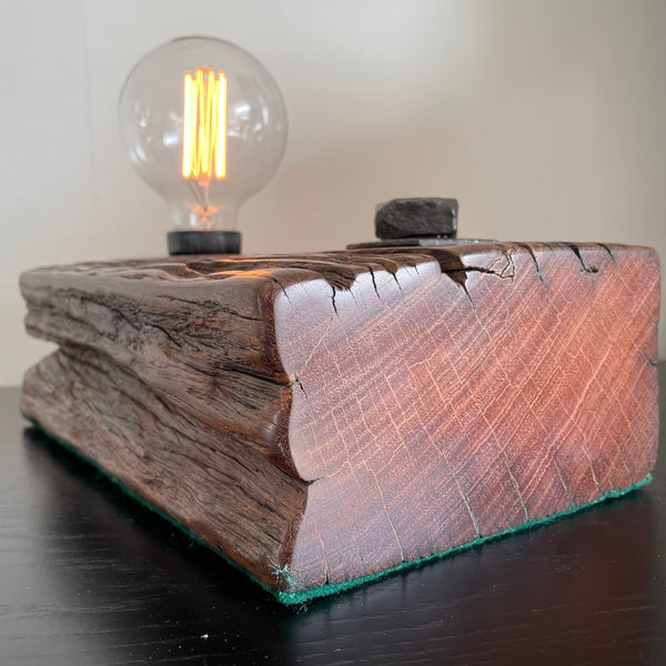 Wooden table lamp upcycled from wharf timber with addition of replica edison bulb, smooth polished end.