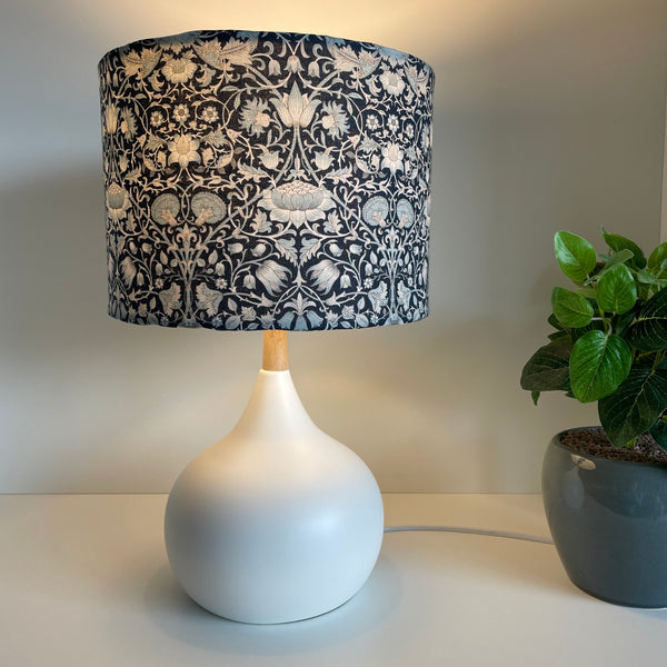 Bespoke drum light shade with William Morris Pure Lodden, Ink fabric, on white base, lit by shades at grays nz