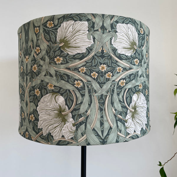 Bespoke medium size drum lamp shade with William Morris Pimpernel Olive fabric, unlit, front view by shades at grays nz.
