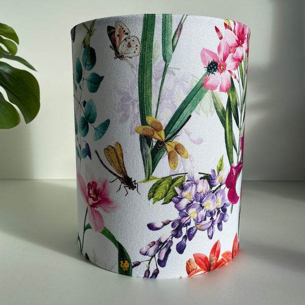 Bespoke medium lamp shade made in nz by shades at grays, showcasing butterfly and dragonflies among the orchids