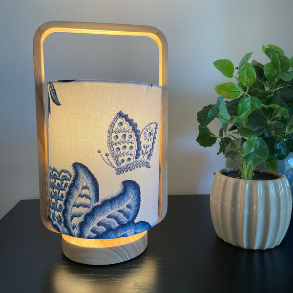 Blue butterfly scandi style table lamp, lit