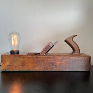 Cleaned and polished restored vintage carpenter's plane with replica edison bulb, by shades at grays, nz.