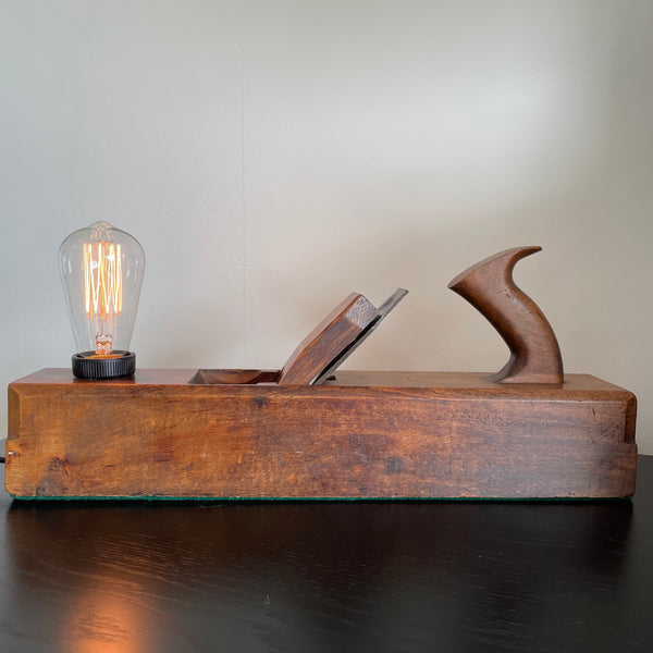 Cleaned and polished restored vintage carpenter's plane with replica edison bulb, by shades at grays, nz.