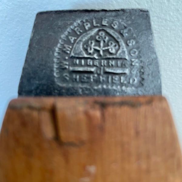 Close-up of authentic Marples and Sons Sheffield maker's mark stamped into a vintage steel plane blade.