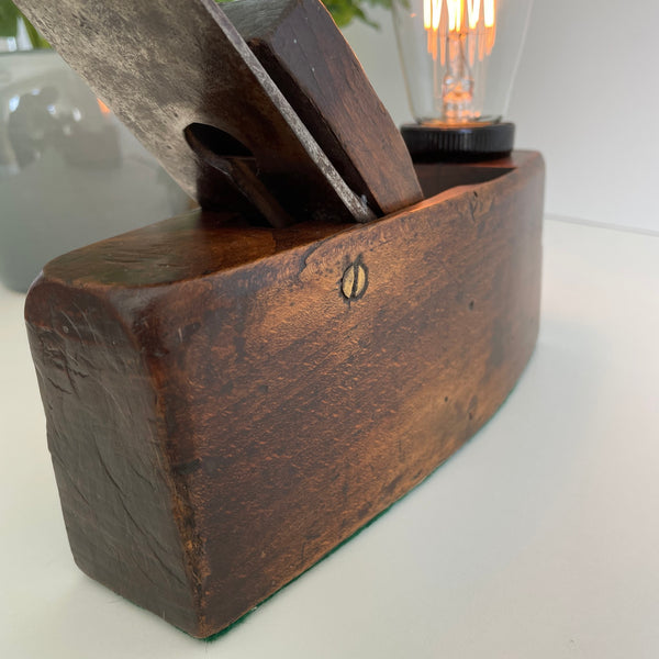 Close up of polished wood on vintage table lamp.