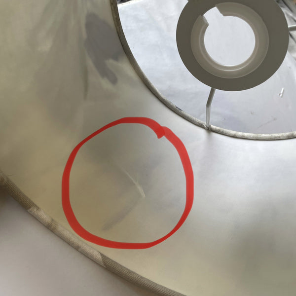 Close up of ding in inner plastic of lampshade