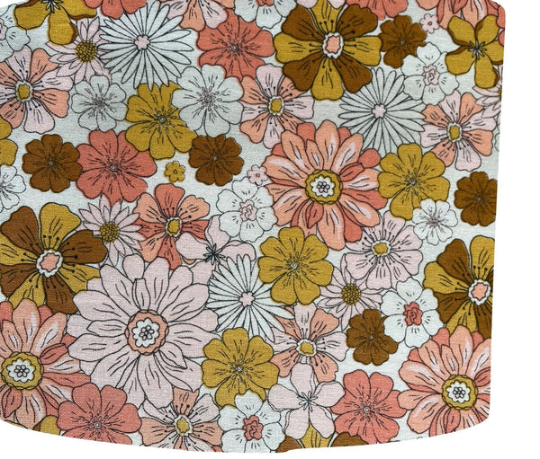 Drum lampshade handcrafted by shades at grays with boho floral garden fabric, close up.