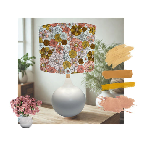 Drum lampshade handcrafted by shades at grays with boho floral garden fabric on white table lamp.