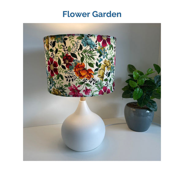 Flower garden fabric on white touch lamp, lit, crafted by shades at grays.