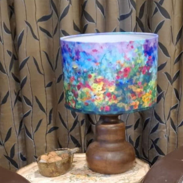 Garden envy lampshade handcrafted by shades at grays on java wood base in lounge setting.