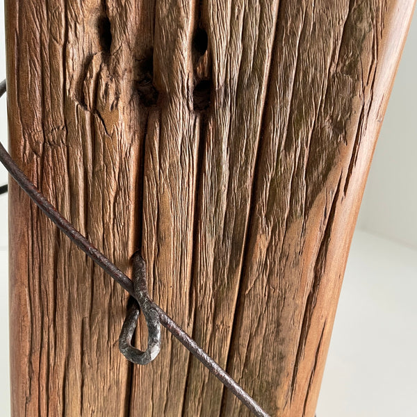 Genuine old wire on wooden table lamp, close up of wood grain and iron.