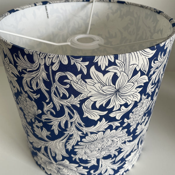 Handcrafted William Morris  blue chrysantemum fabric lampshade, 25 cm x 25cm cylinder, ceiling perspective, unlit, by shades at grays.