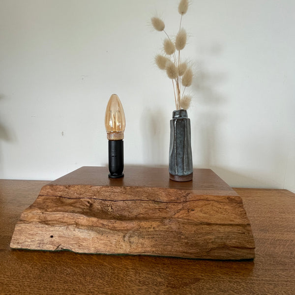 Handcrafted heritage lamp by shades at grays using a reclaimed jarrah beam with additional candle bulb, unlit, front view.