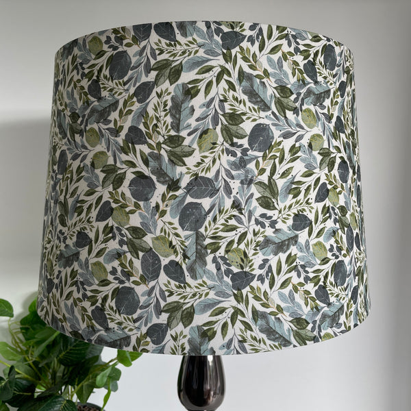 Handcrafted lampshade with Serenity Leaves fabric, tapered 38 shade size, by shades at grays, unlit.