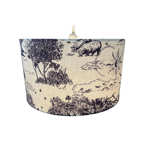 Handmade ceiling lampshade made from Maggie Lam fabric, lit.