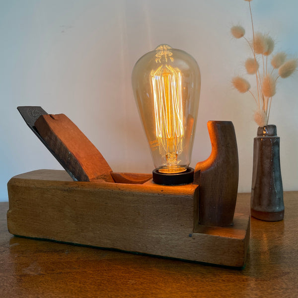 Handmade vintage wood plane lamp by Marples and Sons featuring a warm Edison bulb and polished beech wood base.