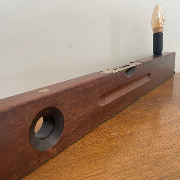 Heritage lamp from long builder's level with added light bulb, unlit, side long view, upcycled by shades at grays.
