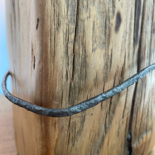 Heritage lamp handcrafted by shades at grays from old tōtara fence post with number 8 wire, close up.