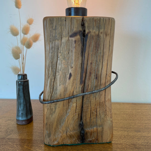 Heritage lamp handcrafted by shades at grays from old tōtara fence post with number 8 wire, front view.