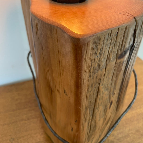 Heritage lamp handcrafted by shades at grays from old tōtara fence post with number 8 wire, side and front view.