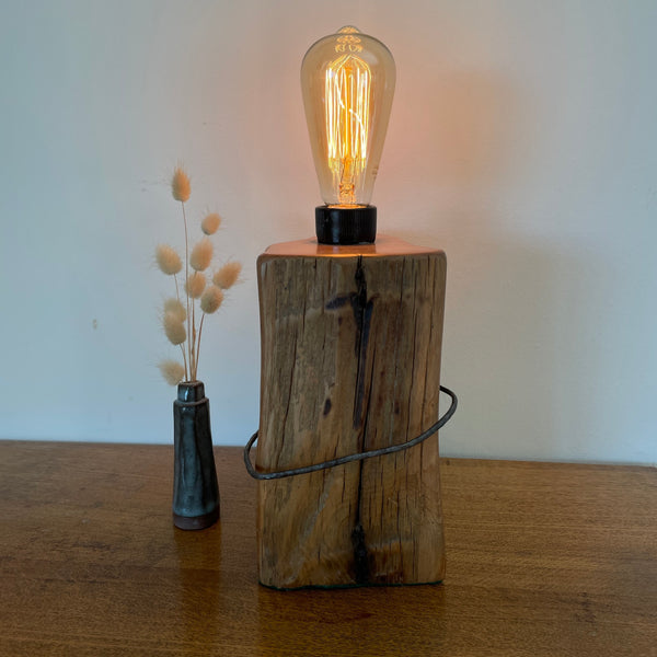 Heritage lamp handcrafted from old tōtara fence post with number 8 wire and replica edison bulb, by shades at grays.