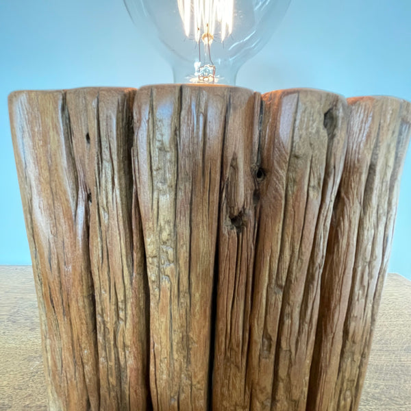 Heritage lamp upcycled by shades at grays, of Totara fencepost, close up of wide lined front with several staple holes.