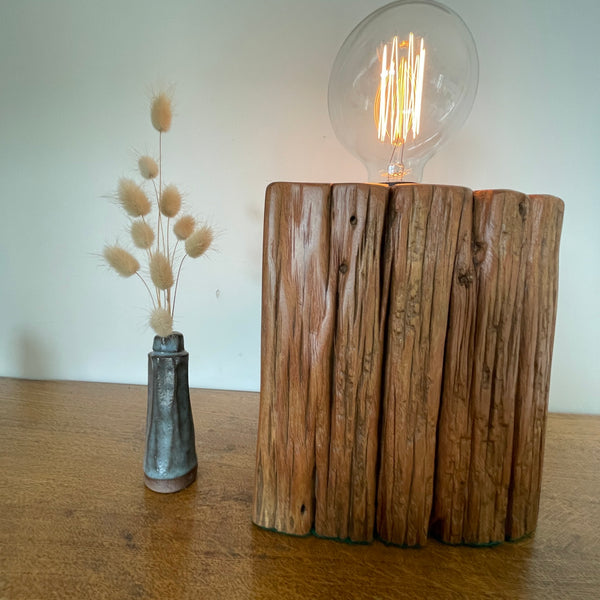 Heritage lamp upcycled by shades at grays, of Totara fencepost with wide lined front with several staple holes.