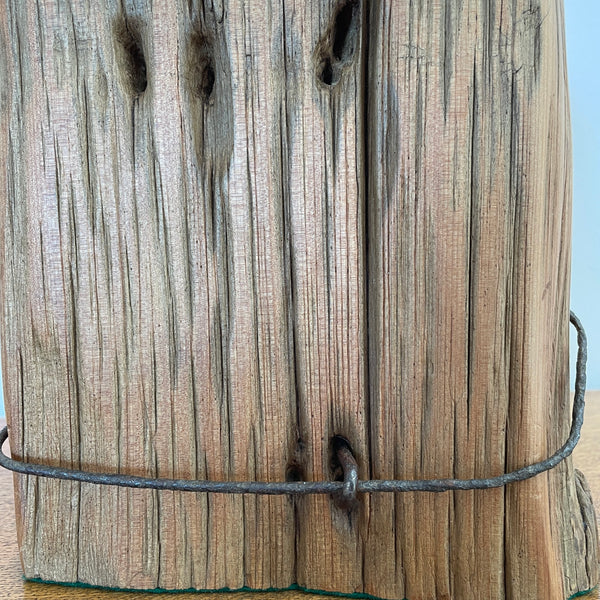 Heritage lamp upcycled from authentic totara post, close up of retained original No 8 wire.