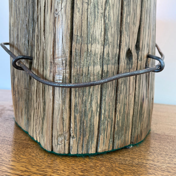 Heritage table lamp upcycled from large round hollowed out Tōtara post, close up of No8 wire  and 2  staples.