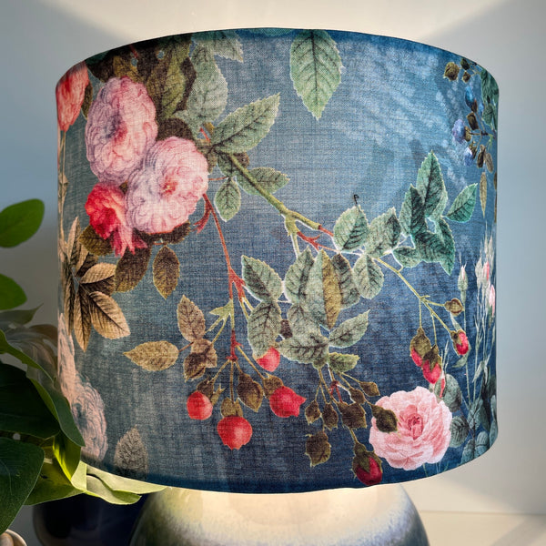Hips and flowers on ocean blue background, handcrafted fabric medium drum lamps shade, made by Shades at Grays, lit.