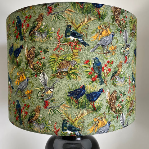 Large barrel handcrafted lampshade with kiwiana birds fabric on black base, by shades at grays
