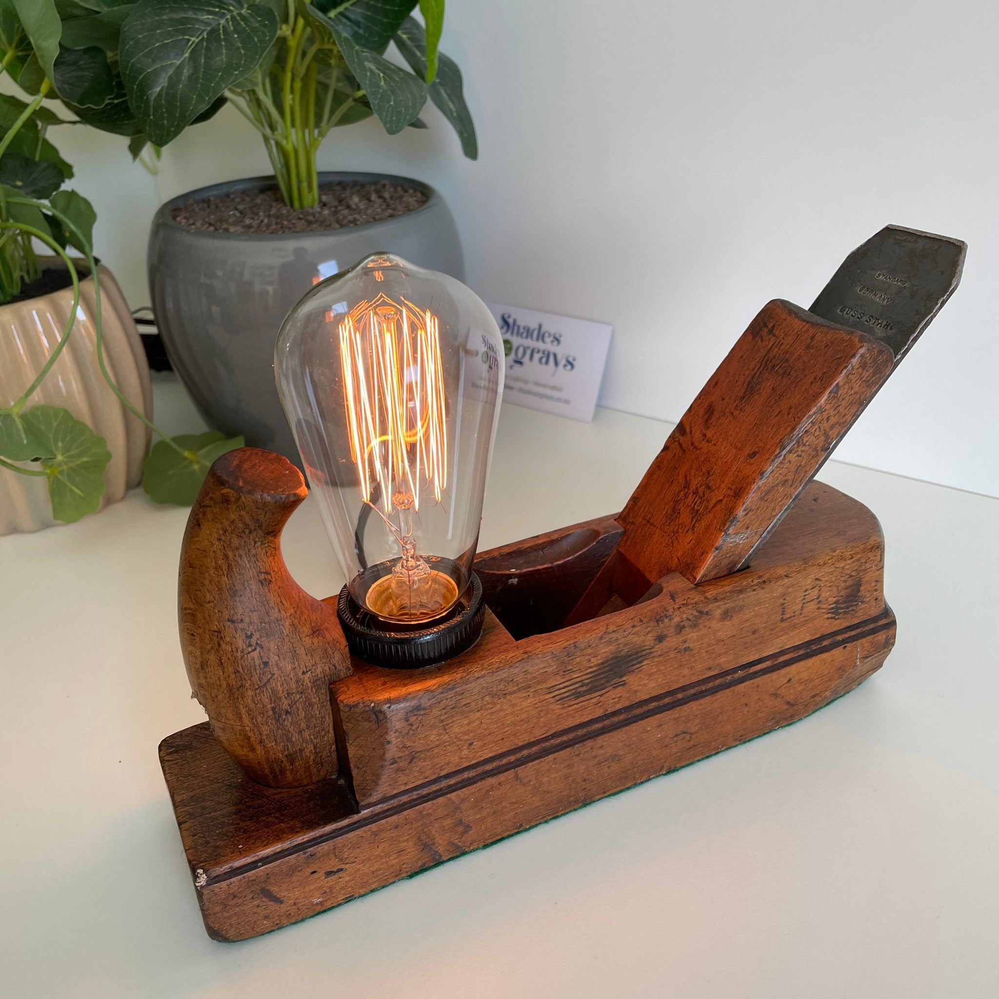 Wooden table lamp from crafted carpenter's wood plane with edision bulb, lit. Made in Wellington, New Zealand by Shades at Grays