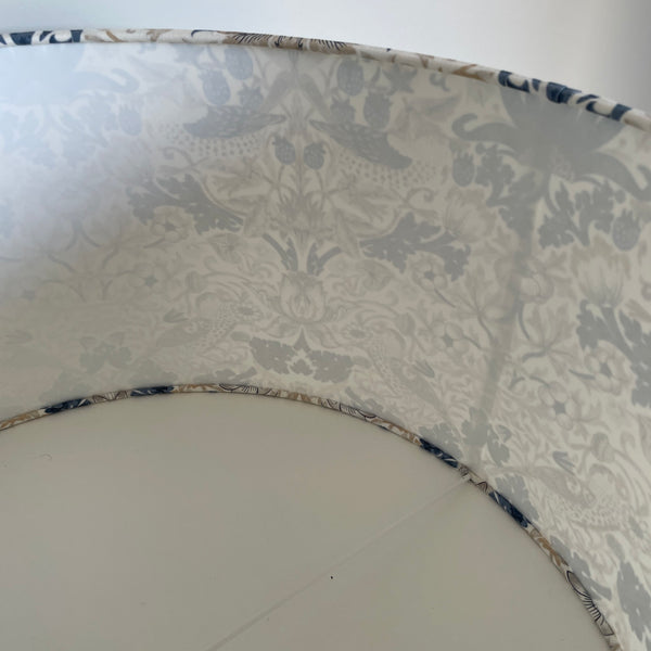 Interior of large barrel lampshade showing shadow from 2nd seam.