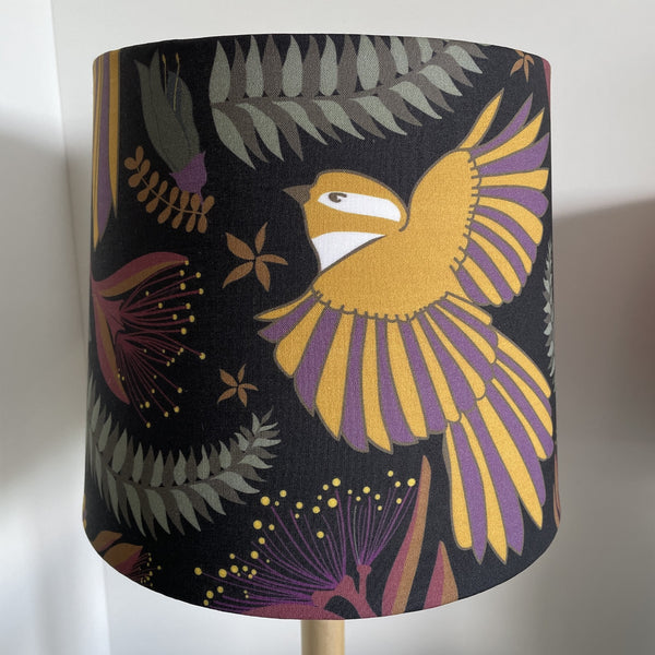Jade Ell designed fantail dance on midnight black fabric on small tapered lampshade, handcrafted by shades at grays, unlit.