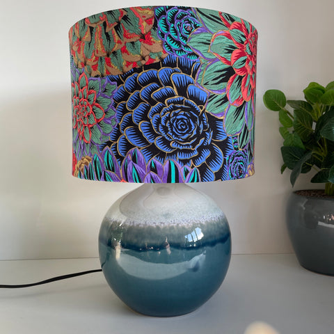Kaffe Fassett House Leeks Dark fabric on handcrafted lamp shade made in nz by shades at grays, on glazed ceramic base.