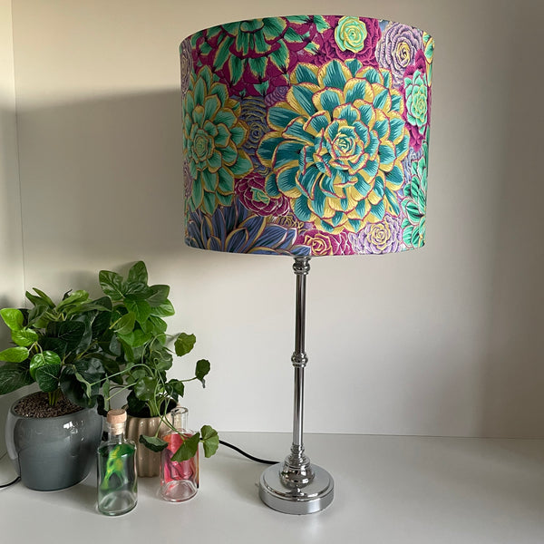 Large drum bespoke lamp shade made in nz by shades at grays using Kaffe Fassett House Leeks fabric grey, unlit on silver base.