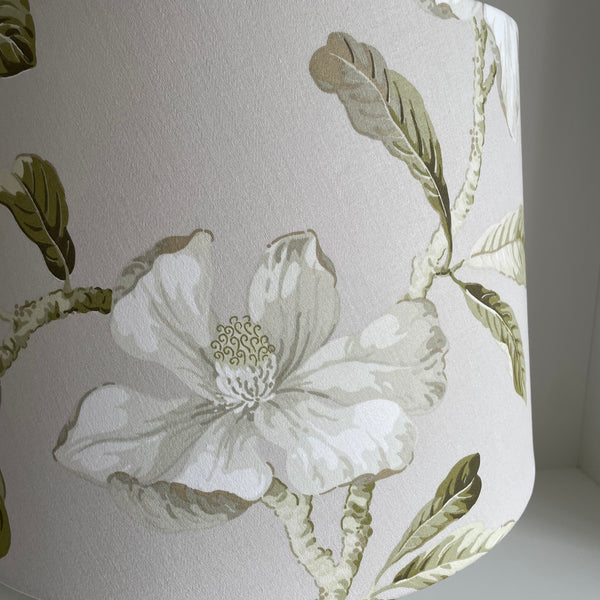 Large 'tapered 46' lampshade with white magnolia fabric, designer light shade, unlit, handcrafted by shades at grays, close up.