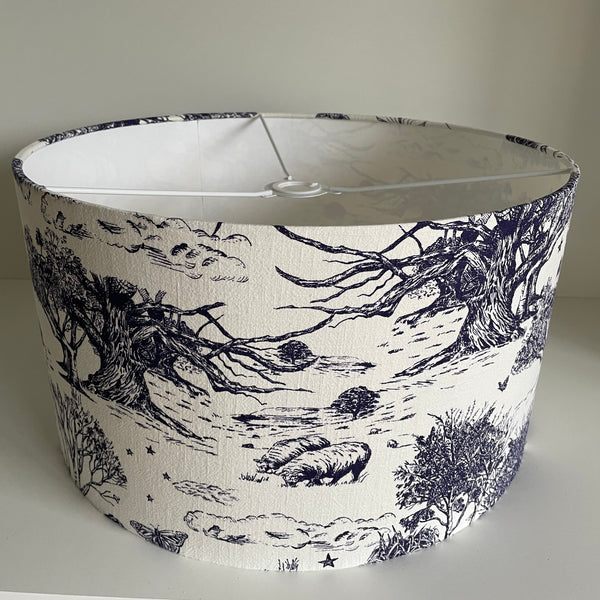Large barrel ceiling lampshade with pastoral scene etched in ink blue on soft white textured background, by shades at grays