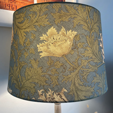 Large tapered lampshade with William Morris Anemone cream fabric, lit, handcrafted by shades at grays.