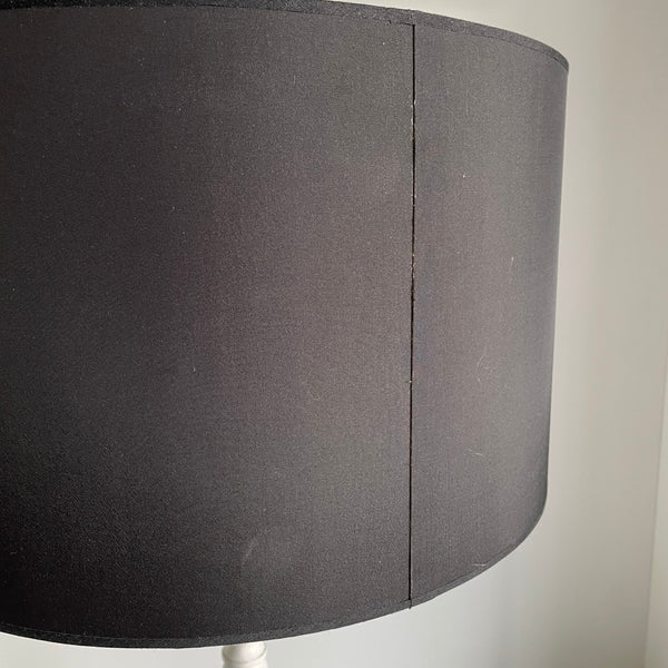 Large black drum lampshade with slight mark and shabby seam on exterior.